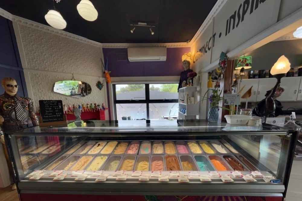 Colourful gelato display cabinet filled with various flavours inside an eclectic store interior in NSW-